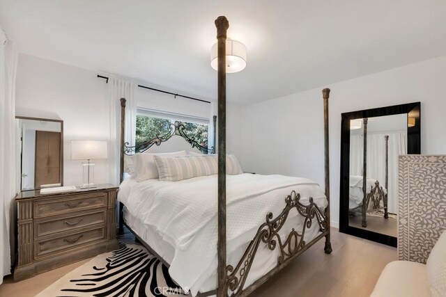 23451 Friar St, Woodland Hills, CA 91367 - bedroom featuring light wood-type flooring