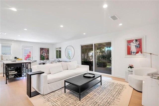 23451 Friar St, Woodland Hills, CA 91367 - living area with light wood-type flooring and recessed lighting