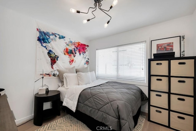 23451 Friar St, Woodland Hills, CA 91367 - bedroom featuring a chandelier and light wood-type flooring