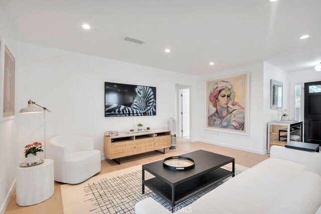 23451 Friar St, Woodland Hills, CA 91367 - living area with light wood-type flooring and recessed lighting