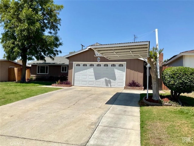 2720 Baylor St, Bakersfield, CA 93305 - ranch-style home with board and batten siding, concrete driveway, and an attached garage