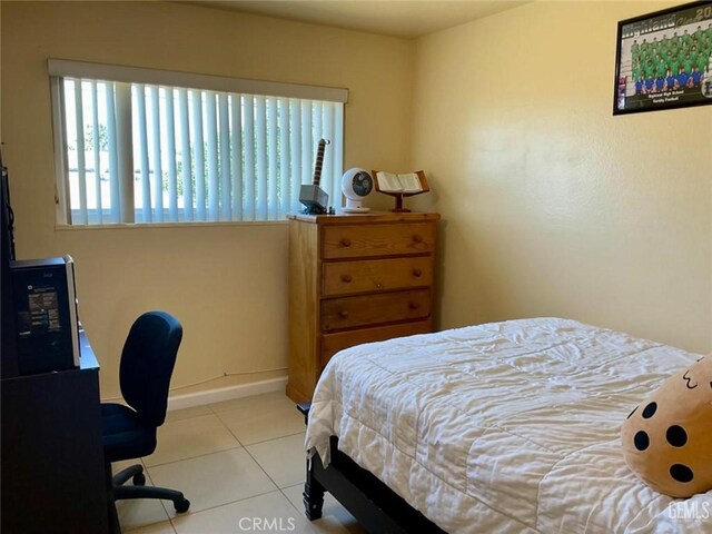 2720 Baylor St, Bakersfield, CA 93305 - bedroom featuring tile patterned flooring and an office area