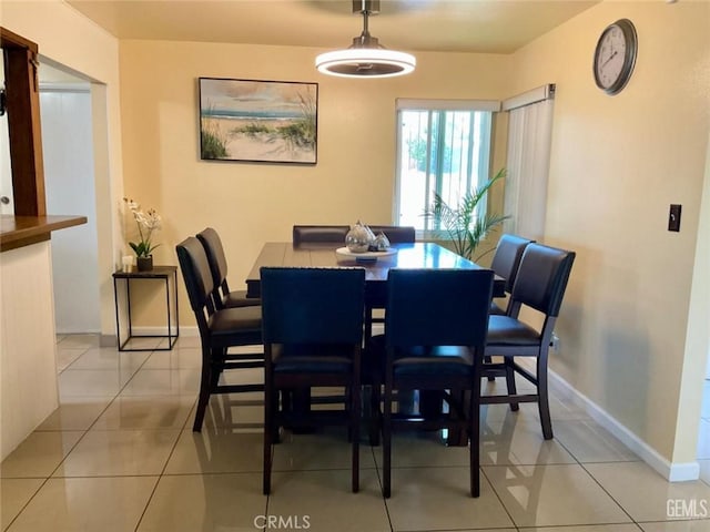 2720 Baylor St, Bakersfield, CA 93305 - dining room featuring light tile patterned floors and baseboards