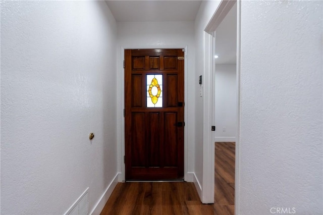 3644 Ardilla Ave, Baldwin Park, CA 91706 - doorway to outside with dark wood finished floors and baseboards