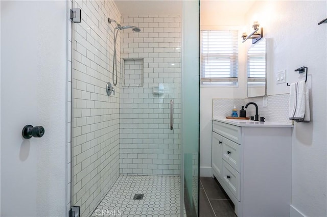 3644 Ardilla Ave, Baldwin Park, CA 91706 - bathroom with a stall shower, vanity, tile patterned flooring, and decorative backsplash