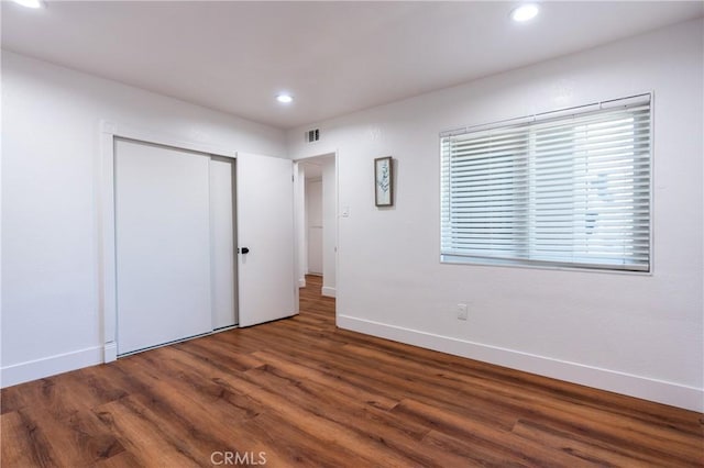 3644 Ardilla Ave, Baldwin Park, CA 91706 - unfurnished bedroom with wood finished floors, recessed lighting, and a closet