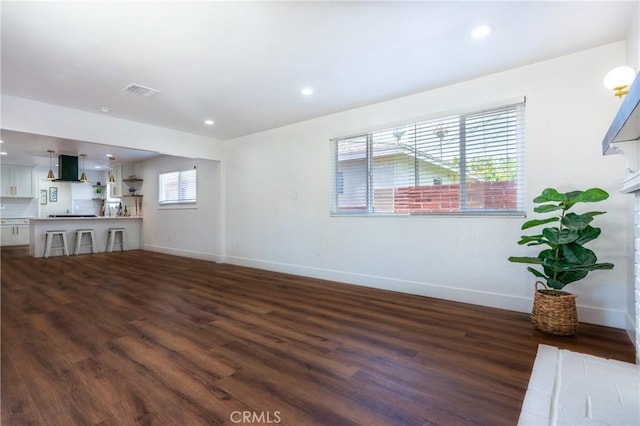 3644 Ardilla Ave, Baldwin Park, CA 91706 - unfurnished living room with dark wood-type flooring and recessed lighting