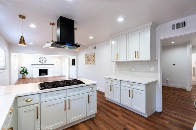 3644 Ardilla Ave, Baldwin Park, CA 91706 - kitchen featuring black gas stovetop, island range hood, dark wood finished floors, light countertops, and recessed lighting