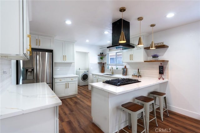 3644 Ardilla Ave, Baldwin Park, CA 91706 - kitchen with stainless steel fridge, open shelves, black gas cooktop, washer / dryer, and island exhaust hood