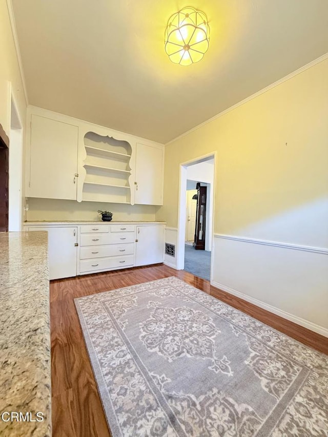 250 S Berkeley Ave, Pasadena, CA 91107 - kitchen featuring white cabinetry, wood finished floors, and ornamental molding
