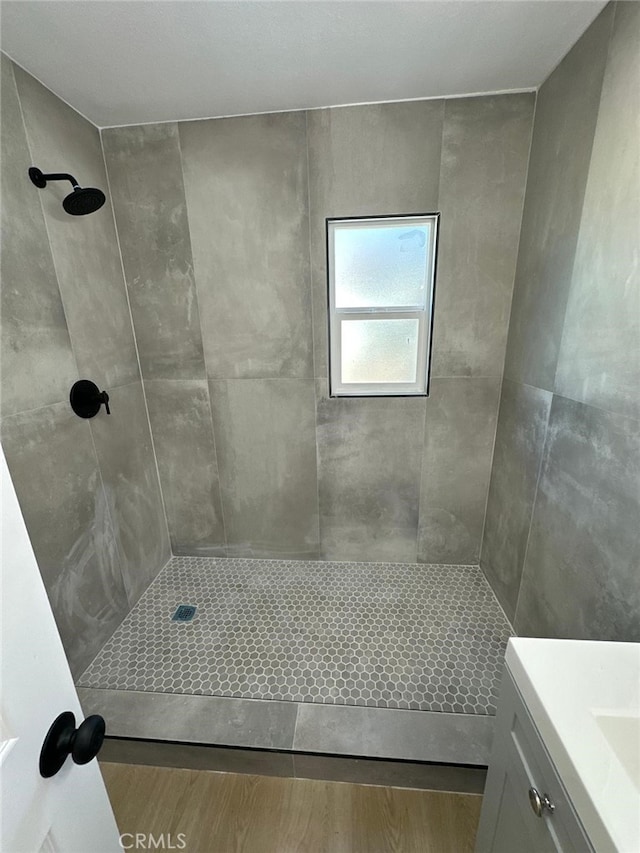 259 Freda Ave, Pomona, CA 91767 - full bath with tiled shower, vanity, and wood finished floors
