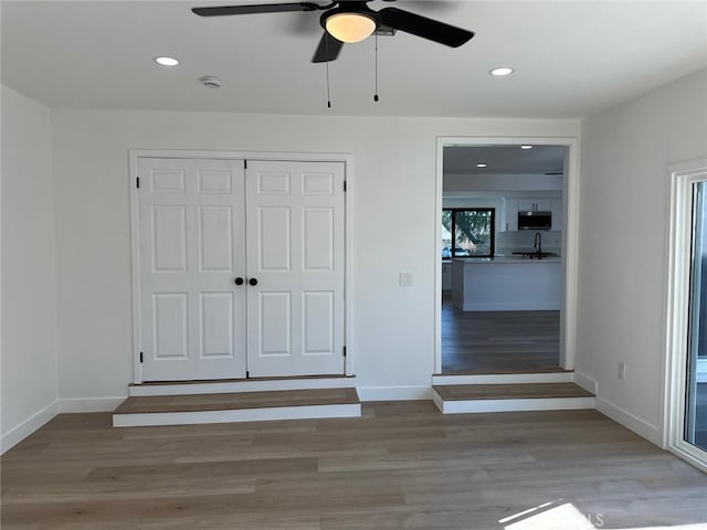 259 Freda Ave, Pomona, CA 91767 - unfurnished bedroom with wood finished floors, recessed lighting, a closet, and ceiling fan