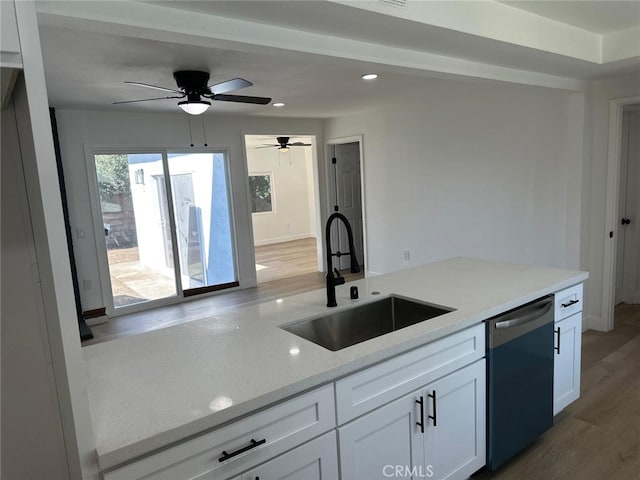 259 Freda Ave, Pomona, CA 91767 - kitchen with dishwasher, white cabinets, light stone counters, wood finished floors, and recessed lighting