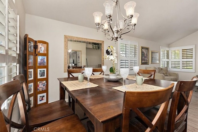 1413 Daisy St, Upland, CA 91784 - dining area with a chandelier, wood finished floors, and vaulted ceiling