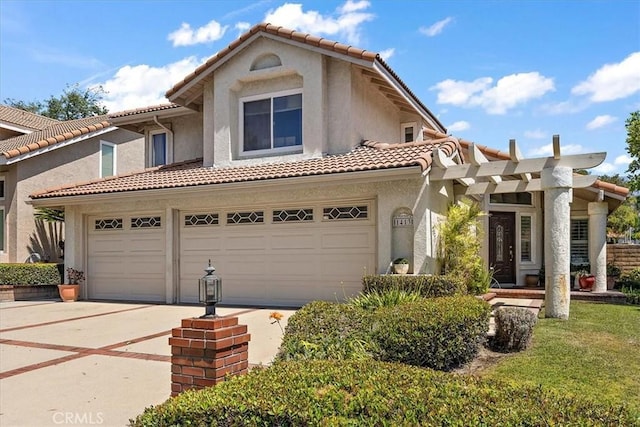 1413 Daisy St, Upland, CA 91784 - mediterranean / spanish home featuring driveway, a tile roof, stucco siding, and a garage