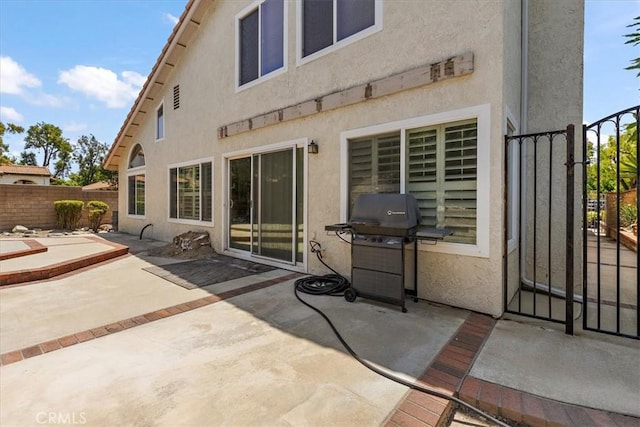 1413 Daisy St, Upland, CA 91784 - back of house featuring stucco siding, a fenced backyard, and a patio area