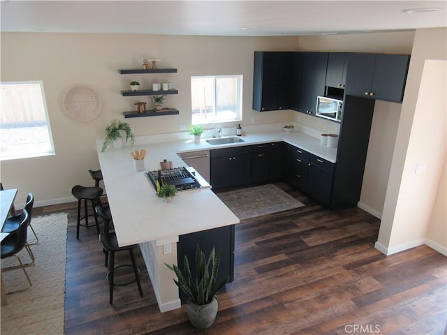 7906 Curbaril Ave, Atascadero, CA 93422 - kitchen with a kitchen bar, open shelves, plenty of natural light, and dark cabinets