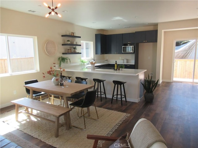7906 Curbaril Ave, Atascadero, CA 93422 - dining space with plenty of natural light, dark wood-type flooring, and a chandelier