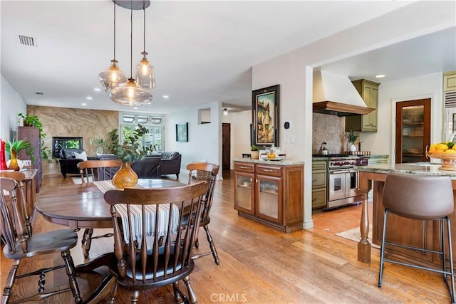 1335 Crestview Ave, Seal Beach, CA 90740 - dining area with light wood-style floors and recessed lighting