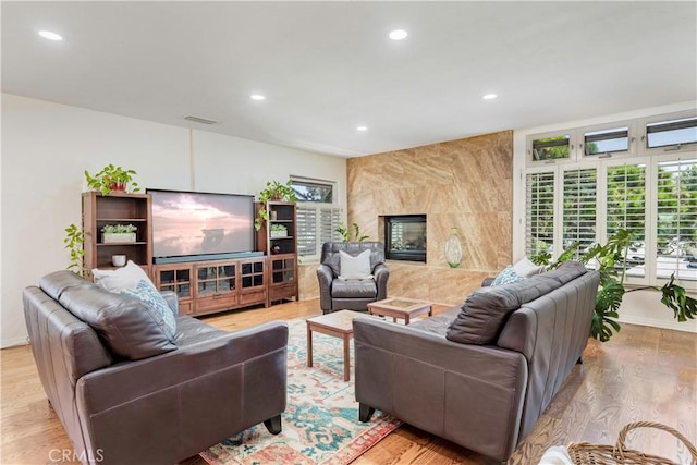 1335 Crestview Ave, Seal Beach, CA 90740 - living room featuring recessed lighting, light wood-style flooring, and a high end fireplace