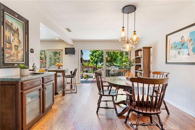 1335 Crestview Ave, Seal Beach, CA 90740 - dining space featuring light wood-style floors and baseboards