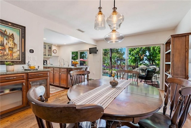 1335 Crestview Ave, Seal Beach, CA 90740 - dining area with light wood-style flooring and recessed lighting