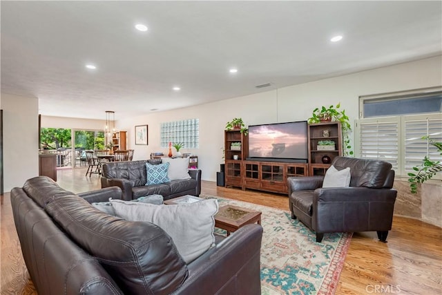 1335 Crestview Ave, Seal Beach, CA 90740 - living room with recessed lighting, light wood-type flooring, and a chandelier
