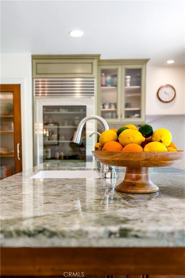 1335 Crestview Ave, Seal Beach, CA 90740 - detailed view of light stone counters, recessed lighting, and glass insert cabinets