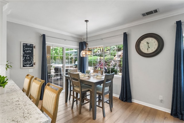 12554 Tejas Ct, Rancho Cucamonga, CA 91739 - dining room featuring light wood-style flooring, healthy amount of natural light, and crown molding