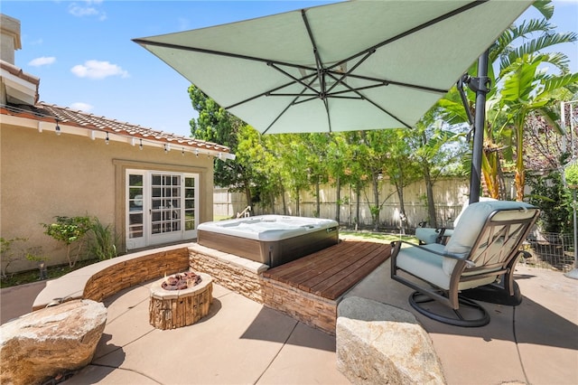 12554 Tejas Ct, Rancho Cucamonga, CA 91739 - fenced backyard with a hot tub, a patio area, and an outdoor fire pit