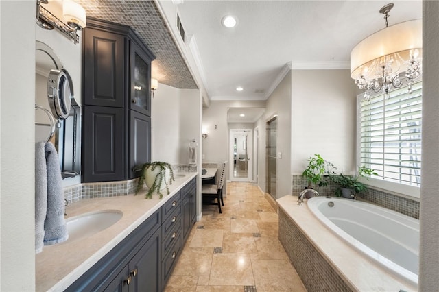 12554 Tejas Ct, Rancho Cucamonga, CA 91739 - bathroom featuring crown molding, a garden tub, double vanity, a chandelier, and recessed lighting