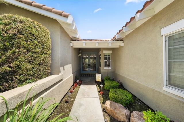 12554 Tejas Ct, Rancho Cucamonga, CA 91739 - view of exterior entry featuring french doors, stucco siding, and a tiled roof