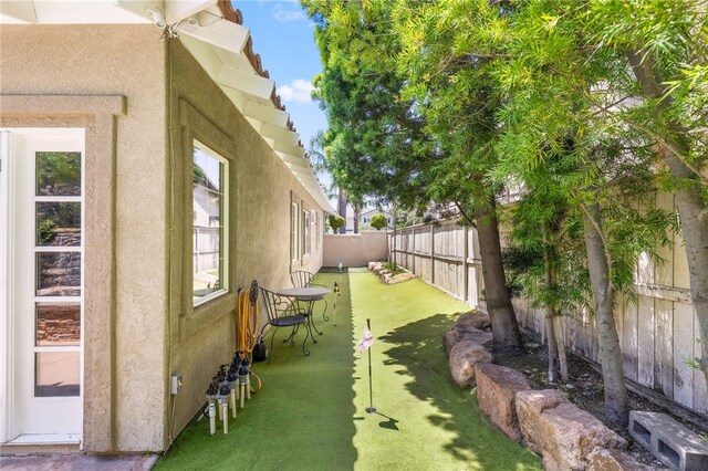 12554 Tejas Ct, Rancho Cucamonga, CA 91739 - fenced backyard featuring an area to practice putting