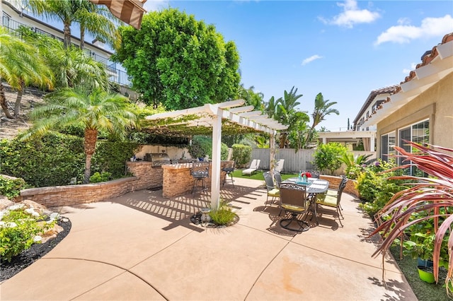 12554 Tejas Ct, Rancho Cucamonga, CA 91739 - view of patio featuring outdoor dining space, an outdoor kitchen, and a pergola