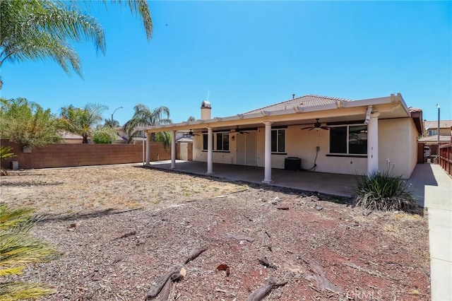 26946 Shelter Cove Ct, Menifee, CA 92585 - back of house with ceiling fan, a patio, a fenced backyard, and stucco siding