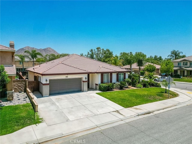 26946 Shelter Cove Ct, Menifee, CA 92585 - view of front of home with a garage, a front yard, concrete driveway, stucco siding, and a tile roof