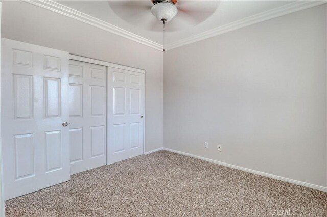 26946 Shelter Cove Ct, Menifee, CA 92585 - unfurnished bedroom with carpet floors, a closet, crown molding, and ceiling fan