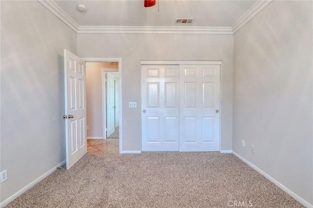 26946 Shelter Cove Ct, Menifee, CA 92585 - unfurnished bedroom with crown molding, light colored carpet, a closet, and a ceiling fan