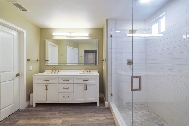 51 Rue Monet, Lake Forest, CA 92610 - full bath featuring double vanity, a shower stall, and wood finished floors