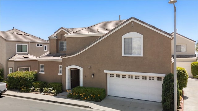 51 Rue Monet, Lake Forest, CA 92610 - traditional home with a garage, stucco siding, concrete driveway, and a tile roof