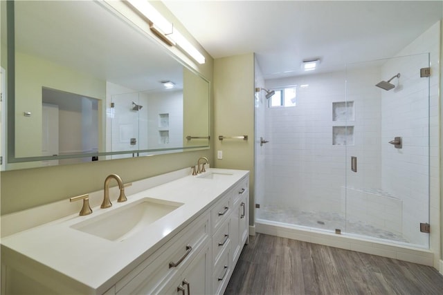51 Rue Monet, Lake Forest, CA 92610 - bathroom featuring double vanity, a shower stall, and wood finished floors