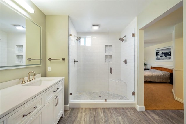 51 Rue Monet, Lake Forest, CA 92610 - full bathroom featuring vanity, wood finished floors, connected bathroom, and a shower stall