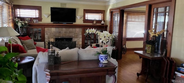 1320 Granada Ave, San Diego, CA 92102 - living room with ornamental molding, a fireplace, wood finished floors, and healthy amount of natural light