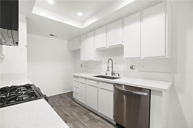 2536 Bryn Mawr Ln, Riverside, CA 92507 - kitchen featuring stainless steel dishwasher, wood finished floors, light countertops, white cabinets, and recessed lighting