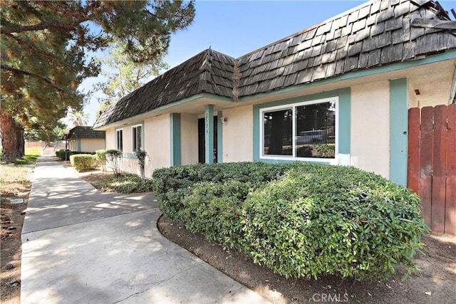 2536 Bryn Mawr Ln, Riverside, CA 92507 - view of side of property with stucco siding and mansard roof