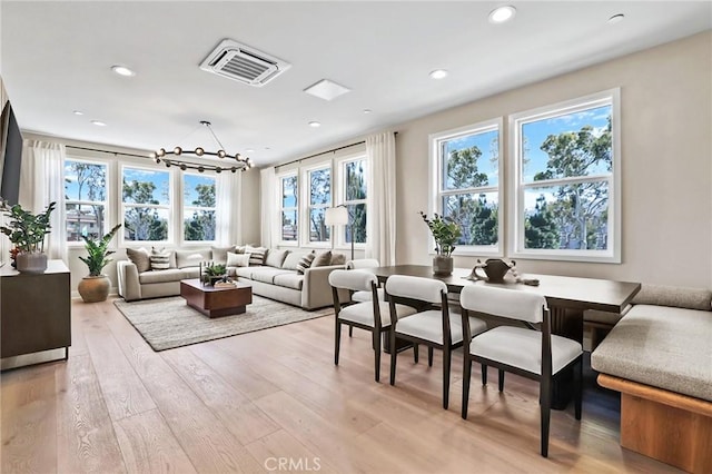19011 Main St Unit 113, Huntington Beach, CA 92648 - living room with light wood-style flooring, a chandelier, and recessed lighting