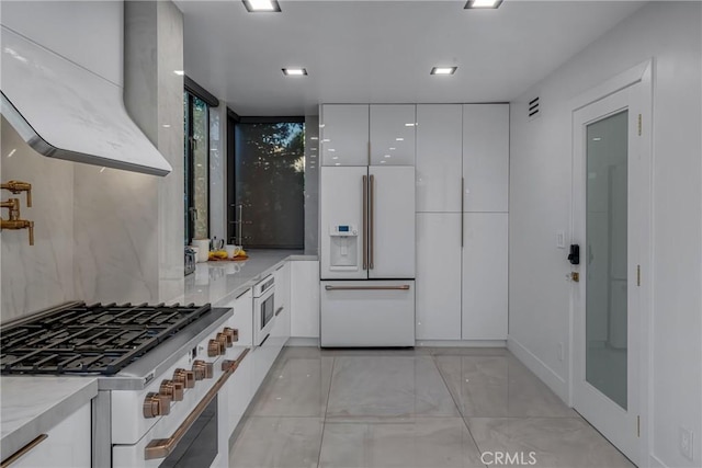 15125 Rayneta Dr, Sherman Oaks, CA 91403 - kitchen with high end white fridge, range, modern cabinets, and white cabinetry
