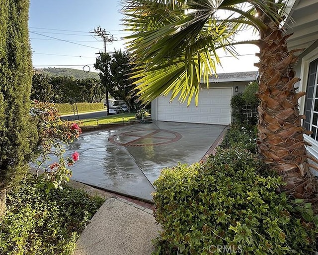 26261 Veva Way, Calabasas, CA 91302 - view of patio with a garage