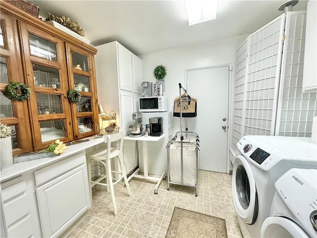 26261 Veva Way, Calabasas, CA 91302 - washroom featuring separate washer and dryer and cabinet space
