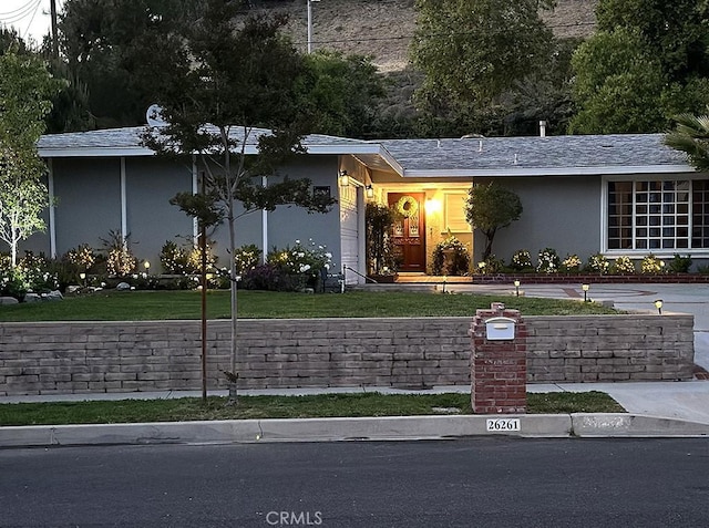 26261 Veva Way, Calabasas, CA 91302 - ranch-style home featuring stucco siding and a front lawn